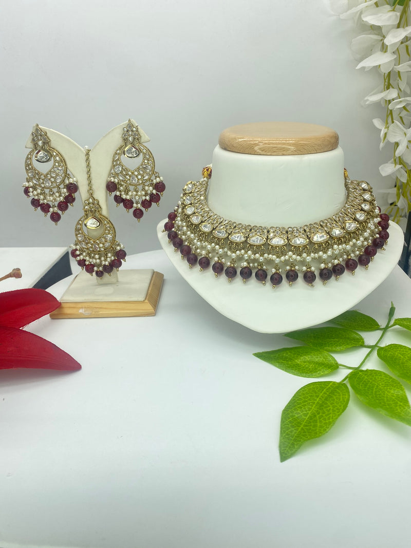 Kundan with a touch of Ruby Pearls