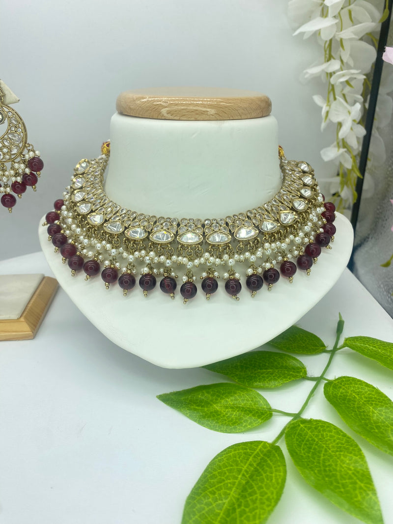 Kundan with a touch of Ruby Pearls